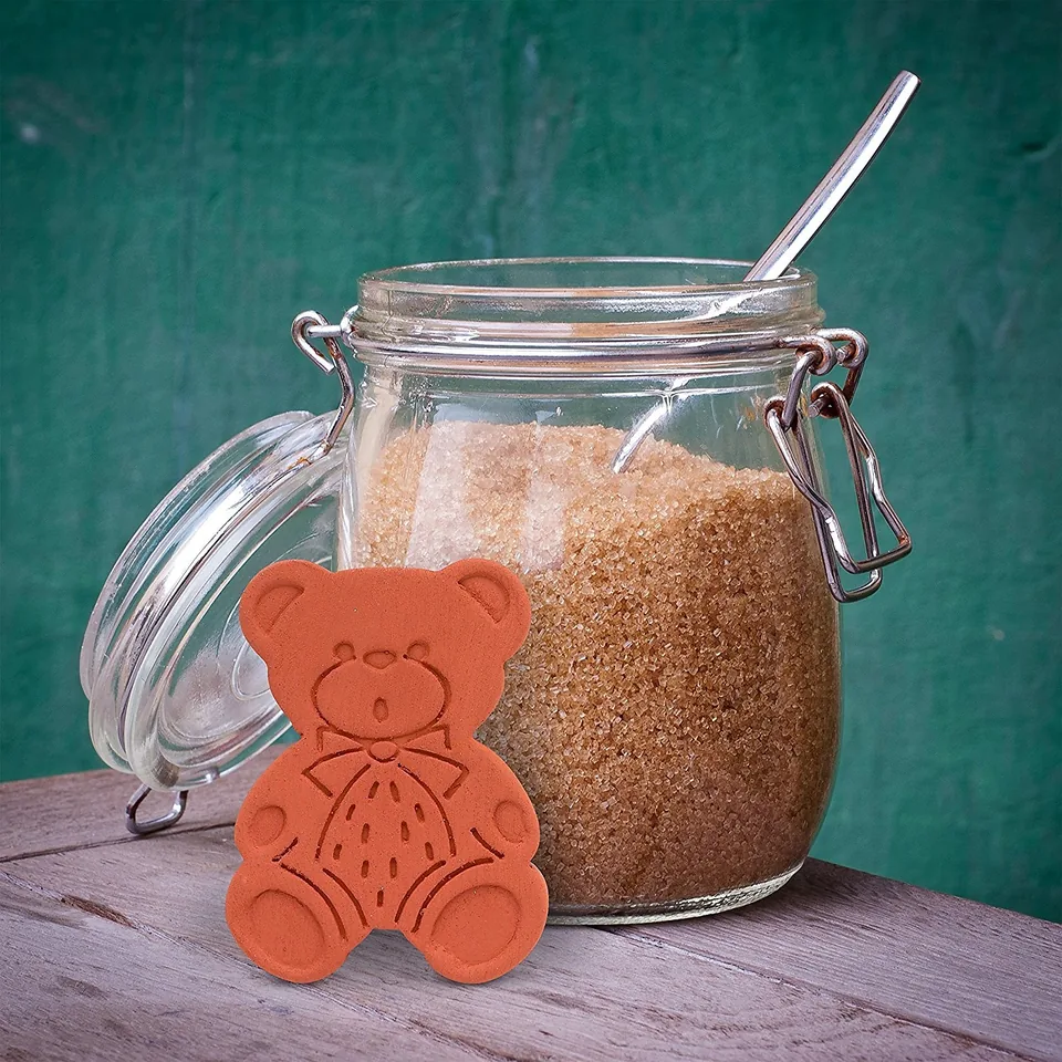 Brown Sugar Bear beside an open jar of brown sugar